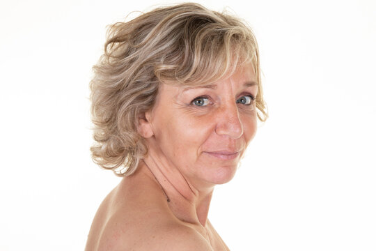 Nude Portrait Of Beautiful Mature Woman senior Over white Background Closeup