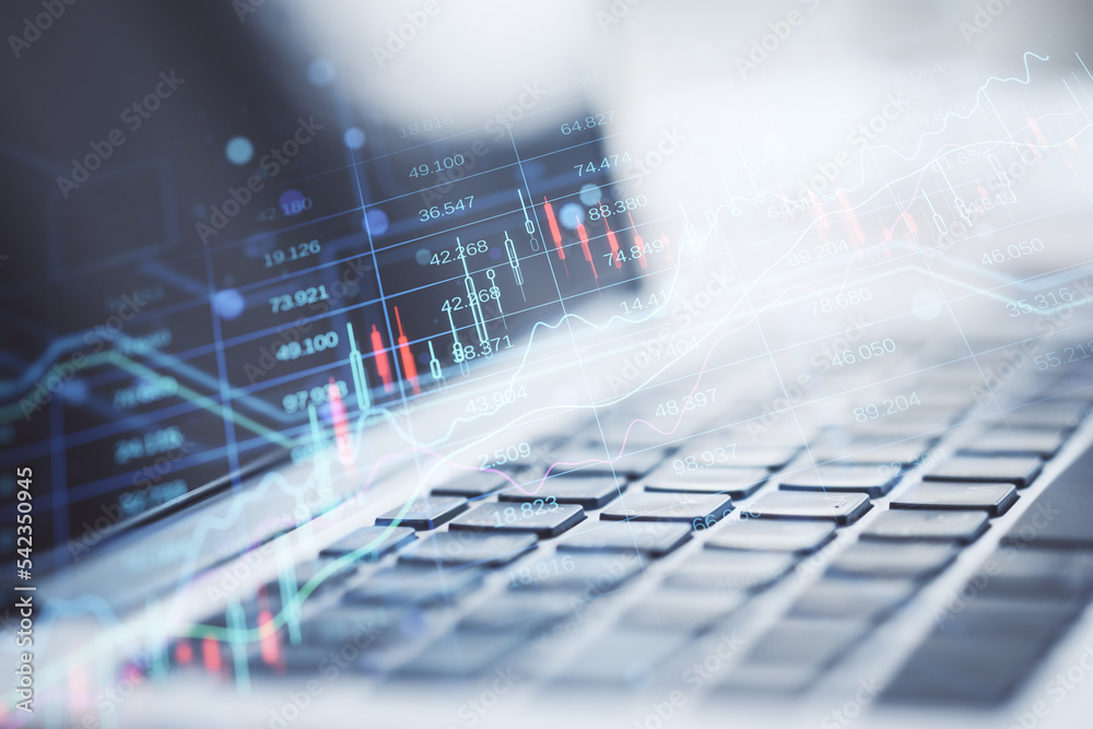 Leinwandbilder close up of laptop computer keyboard with creative candlestick forex chart index hologram on blurry 