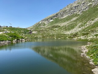 Fototapeta na wymiar Summer atmosphere on the Lago dei Morti or Lake of the Dead (Totensee) in the Swiss alpine area of mountain St. Gotthard Pass (Gotthardpass), Airolo - Canton of Ticino (Tessin), Switzerland (Schweiz)