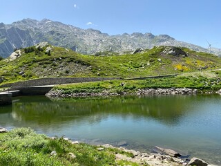 Summer atmosphere on the Lago dei Morti or Lake of the Dead (Totensee) in the Swiss alpine area of mountain St. Gotthard Pass (Gotthardpass), Airolo - Canton of Ticino (Tessin), Switzerland (Schweiz)