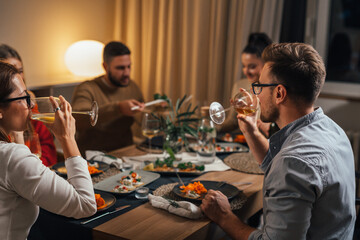 friends gathering on home dinner party