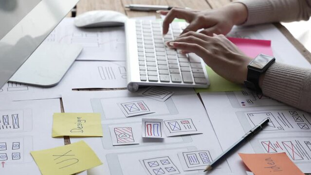 Website designer, Creative planning phone app development template layout framework wireframe design, User experience concept, Young asian woman UX designer working on smartphone application at office
