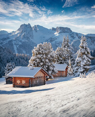 Gorgeous morning view of Alpe di Siusi village. Stunning winter landscape of Dolomite Alps....