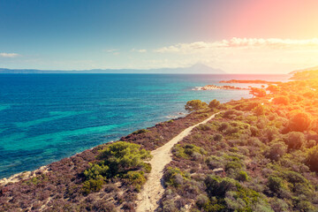 Seascape on a sunny day, view from above. Rocky beach with beautiful bays. Vourvourou Greece Europe