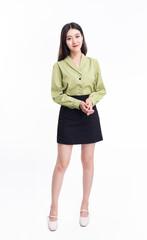 A business woman in a green suit and a black skirt against a white background