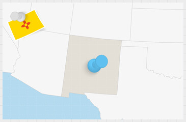 Map of New Mexico with a pinned blue pin. Pinned flag of New Mexico.