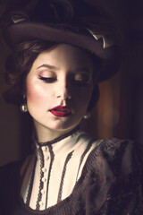 Very beautiful woman, close-up portrait, vintage hat, stylized retro look, low key