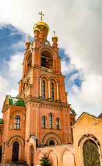 Christian church cross in high steeple tower for prayer