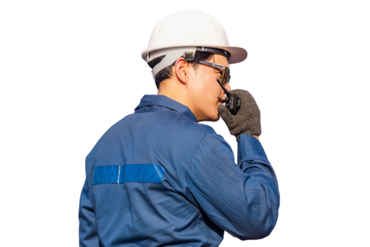 Foreman in hardhat and safety vest talks on two-way radio control loading containers box from cargo