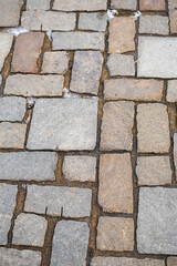 Road paving slabs pattern. Way paved with stones.
