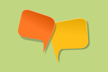 orange and yellow speech bubble paper cut on green background. Conceptual image about communication and social media, customer feedback