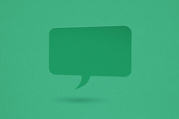 blank green speech bubble grunge paper cut, on grunge green paper background. Conceptual image about communication and social media