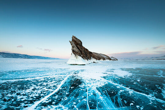 Ogoy island on winter Baikal lake with blue ice. Baikal, Siberia, Russia.