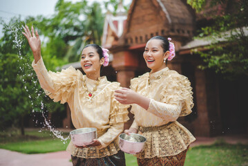 Portrait beautiful women in Songkran festival with Thai Traditional costume
