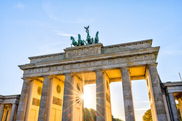 The famous Brandenburg Gate in Berlin with the last sun rays before sunset © elxeneize
