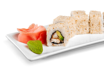 Tasty Sushi rolls on plate on  background