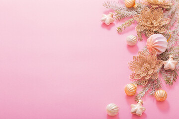 golden christmas decorations  on pink background