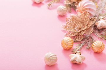 golden christmas decorations  on pink background