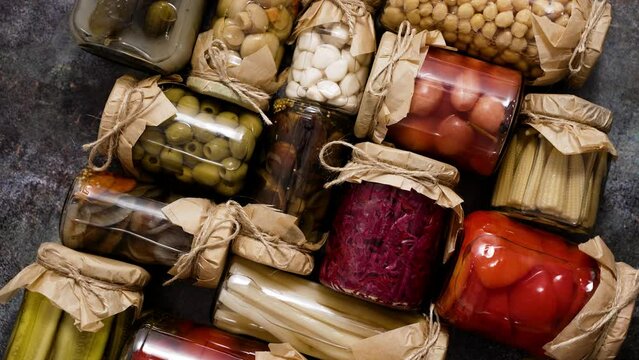 Preservation of vegetables in glass jars. Tomatoes, cucumbers, mushrooms, cabbage, pepper