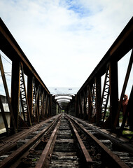 Fototapeta na wymiar old and historical train bridge over the river