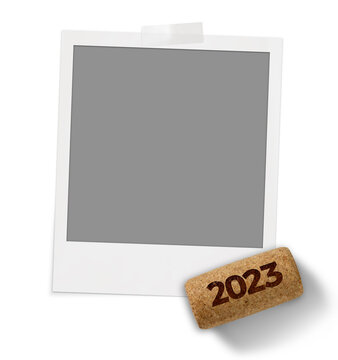 Photo frame on a white background, with a wine stopper and the year 2023.