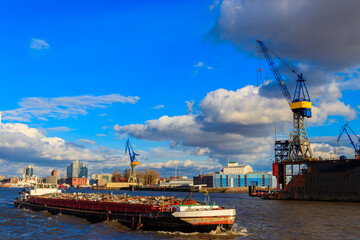 Industrial barge carrying scrap metal for recycling on the river Elbe in Hamburg, Germany - obrazy, fototapety, plakaty