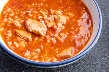 kharcho red tomato soup meat, rice meal food snack on the table copy space food background 