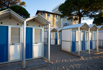 Italy, Friuli Venezia Giulia, Grado, Rows of beach huts on beach