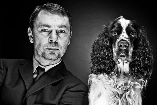 Portrait of mature man with English Springer Spaniel