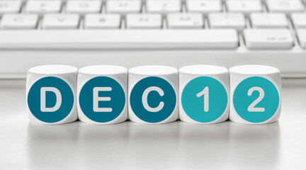 Letter dice in front of a keyboard - December 12