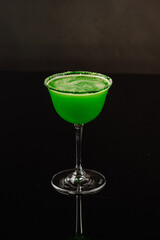 Freshy green cocktail on the black background