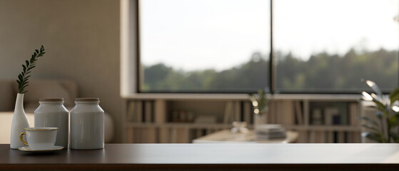 Close-up, Dark wooden tabletop with coffee cup, decor and copy space over blurred living room