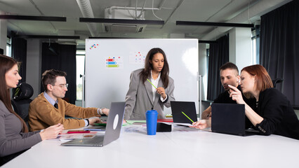 African american woman conducts training for office staff