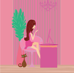 Online shopping - young smiling woman sitting with laptop computer