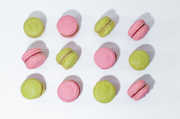 pink green pistachio raspberry macarons french dessert white elegant  background