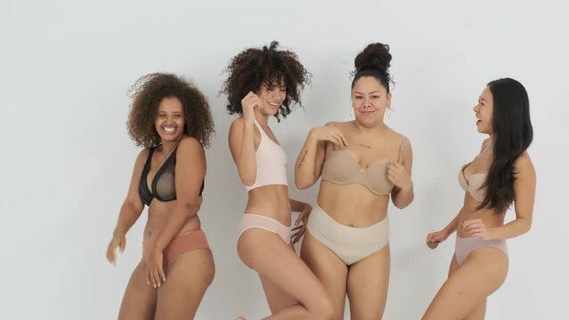 Diverse women dancing and smiling