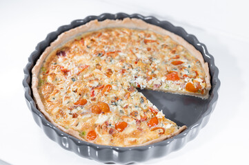 quiche blue cheese sun dried tomatoes portion white background