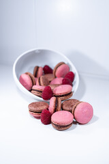 raspberry chocolate macarons, pink brown white dish, french dessert