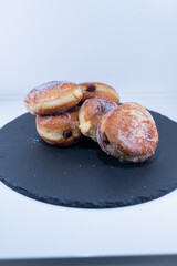 doughnut Berliners cream chocolate handmade black plate
