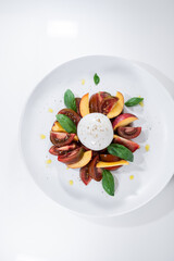 burrata tomato peach fruit salad circle white elegant dish basil