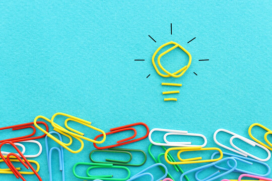 Concept image of unique thinking. Paper clips in the shape of light bulb. Idea of education and innovation