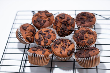 chocolate chips muffins white background black grid rack