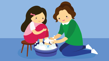 Mom washes her daughter's feet in a basin