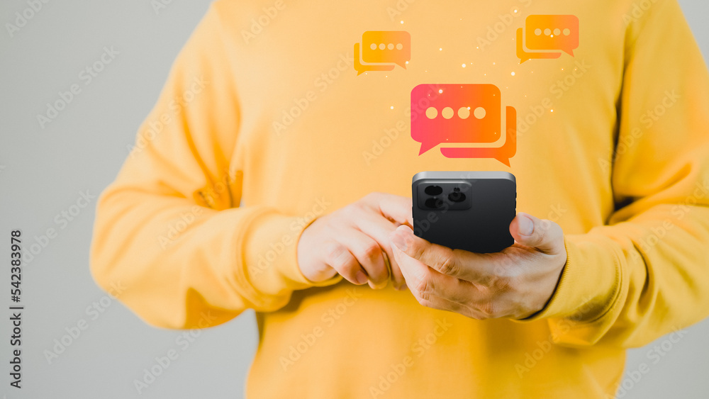 Fototapete Man hand using smartphone typing live chat chatting on application communication digital web and social network concept. Social media application chat box.