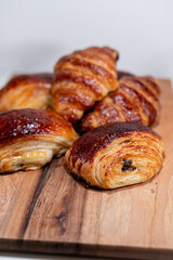 croissant, pain au chocolat bakery french dessert wood board 
