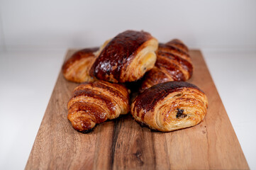 croissant, pain au chocolat bakery french dessert wood board 