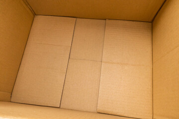 Open empty brown cardboard box background top view
