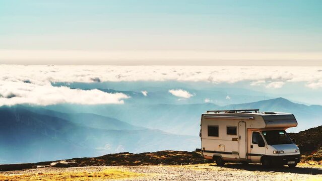 Caravan camping in mountains above clouds. Torre mountain peak of Serra da Estrela in Portugal. Place to visit. Adventure and holiday by  mobile home.