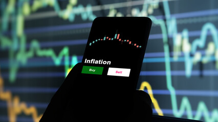 An investor's analyzing the inflation etf fund on screen. A phone shows the ETF's prices stocks to...