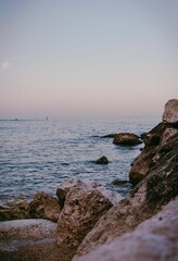 Vertical shot of the sea stacks with a clear sky in the background